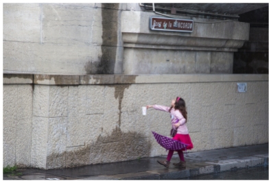 Street photography. Collecting rain 1, by the Seine in Paris, France